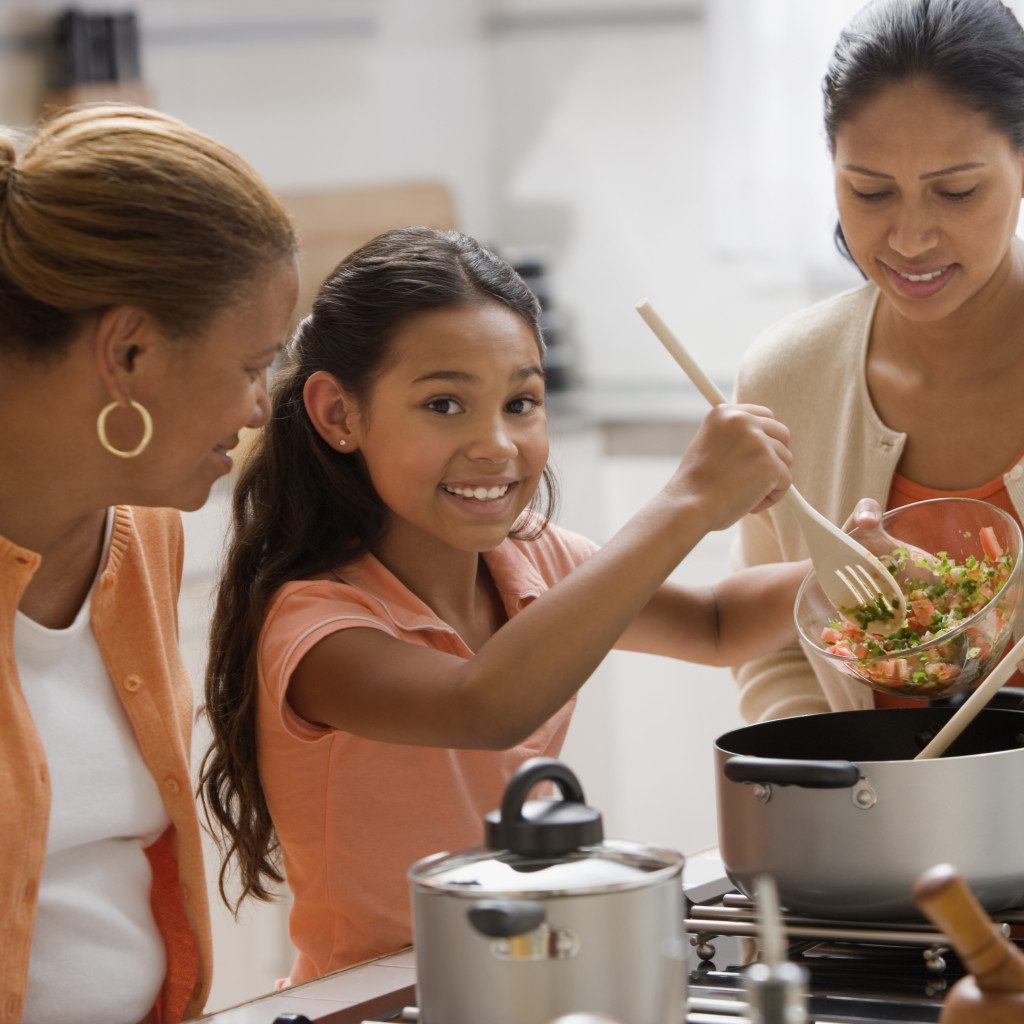 Mother and daughters cooking